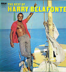 Harry Belafonte as a young man, standing on a boat for an album cover, titled "The Best of Harry Belafonte."